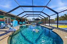 Sleeps 14 • Sport Court • Tiki Bar • Heated Pool
