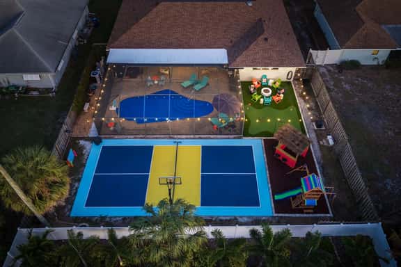 Sleeps 14 • Sport Court • Tiki Bar • Heated Pool - Image 1