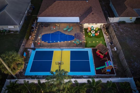 Sleeps 14 • Sport Court • Tiki Bar • Heated Pool